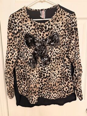 Mauve Leopard Print Top with Black Accents
Sheer back